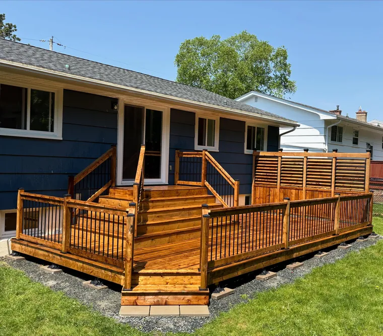 Cedar deck and privacy wall on a navy home in Bedford, Nova Scotia