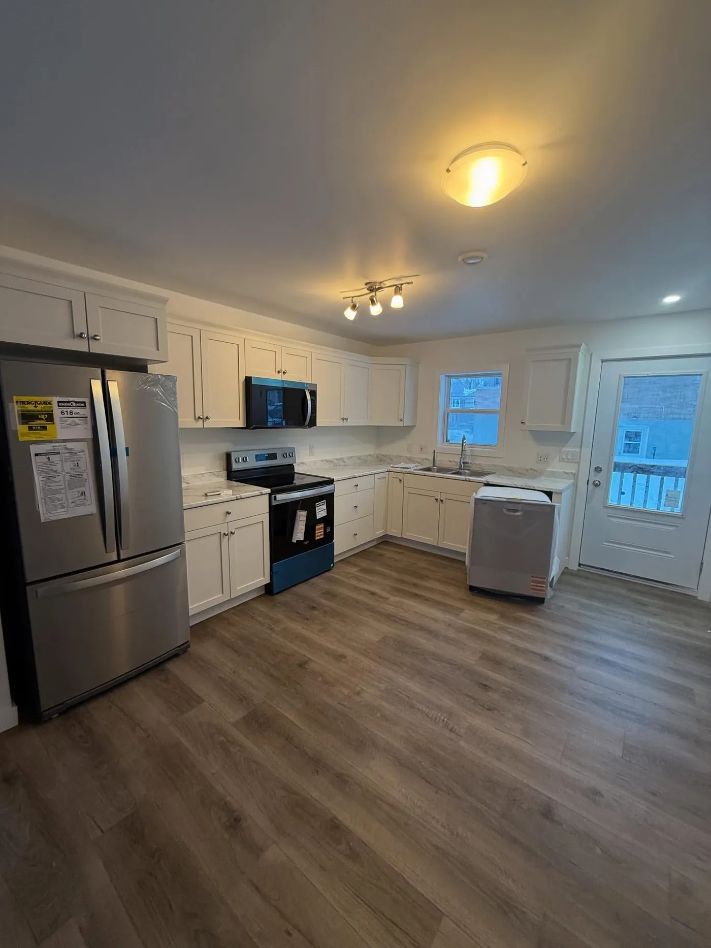 Luxury white kitchen remodel completed by Nova Core Construction in Halifax